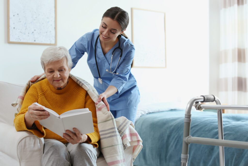 caregiver assisting a senior while providing home care services